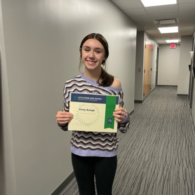 students smiling holding certificate